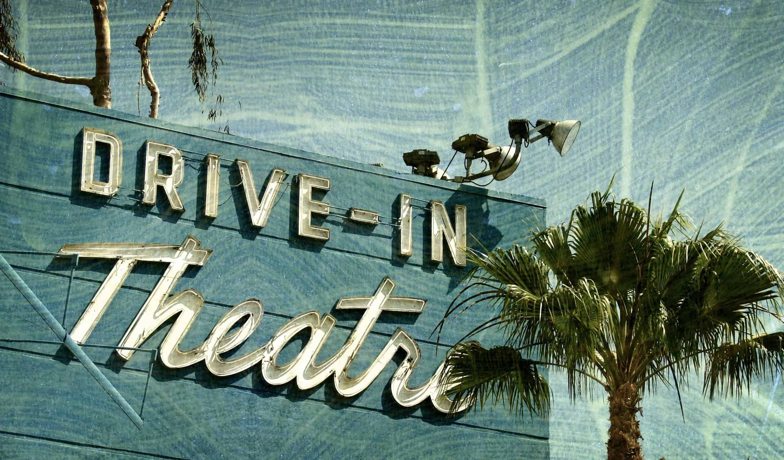 Drive-In Theatre Billboard With a Palm Tree