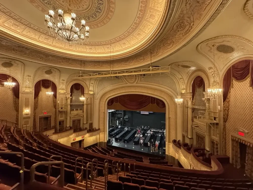 The newly renovated interior of the Majestic Theater, showcasing restored seating, balconies, and chandeliers