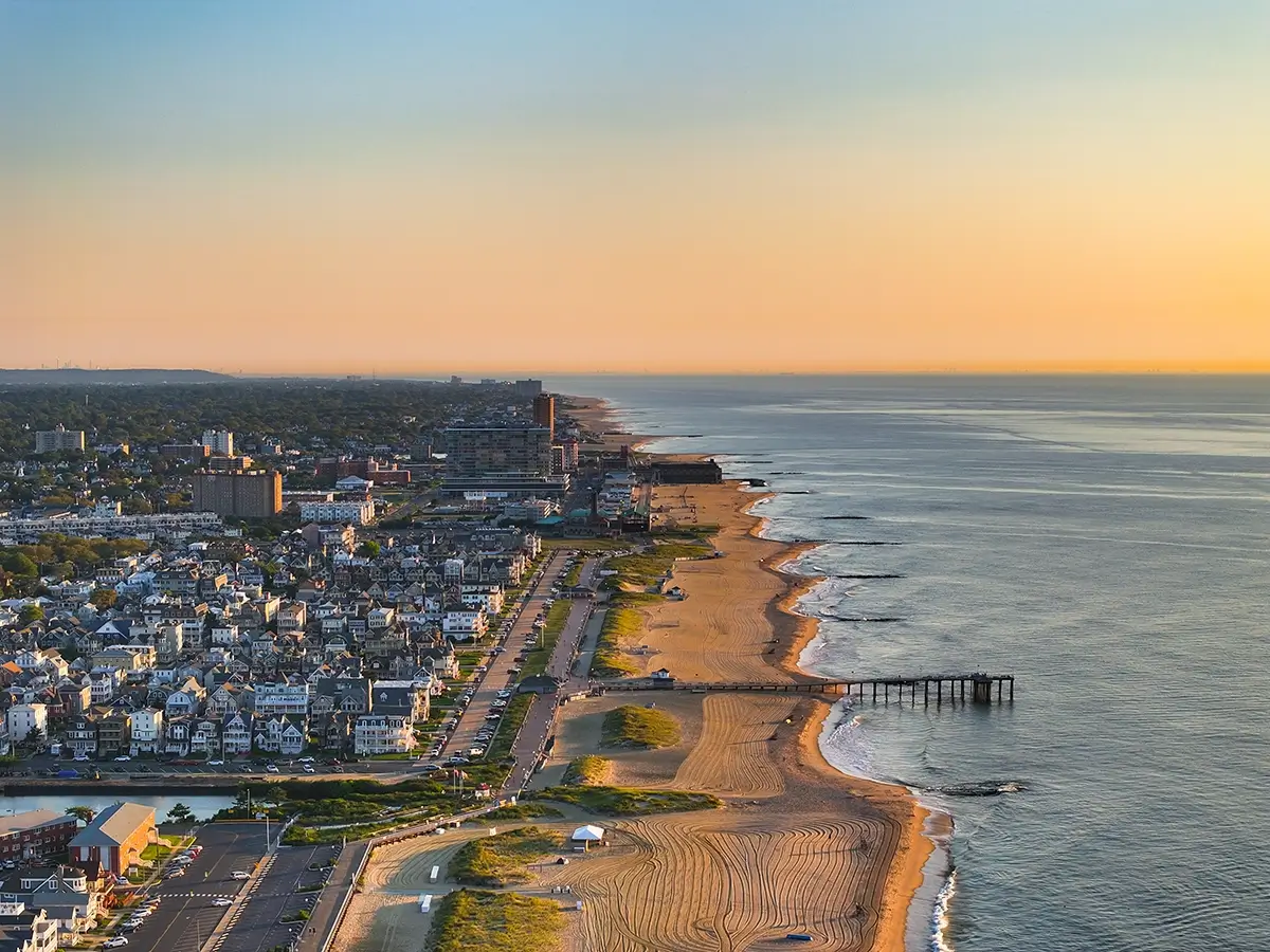 An Aerial View of New Jersey's Coastline, describing the articles insight into NJ's Plan to Combat Climate Change and the REAL Initiative