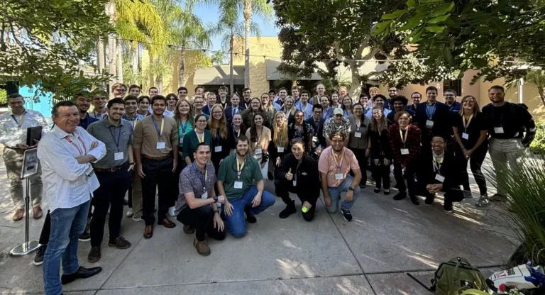 A group photo featuring students and mentors at the ASTM F24 Conference